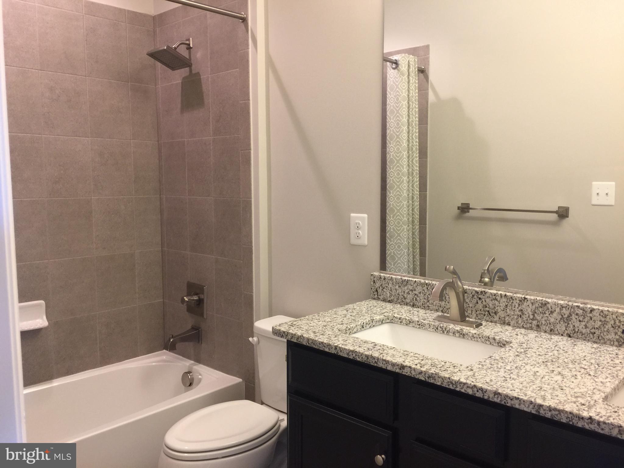 503 Cliff Lane Malvern, PA 19355 - Photo 14 of 38 a bathroom with a granite countertop sink toilet and shower