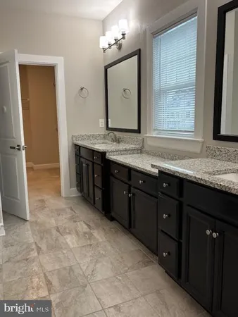 a view of a bathroom with a glass door shower