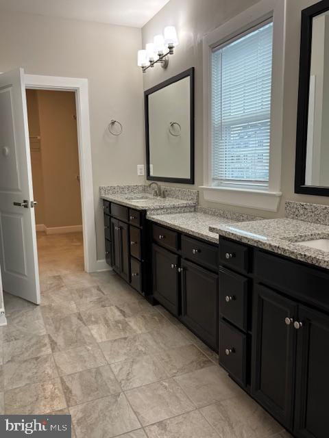 503 Cliff Lane Malvern, PA 19355 - Photo 35 of 38 a bathroom with a granite countertop sink and a mirror