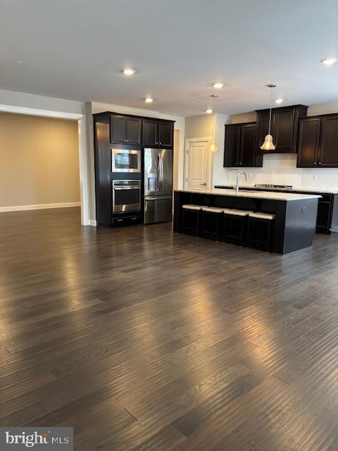 503 Cliff Lane Malvern, PA 19355 - Photo 38 of 38 a kitchen with stainless steel appliances kitchen island granite countertop a stove a sink and a microwave