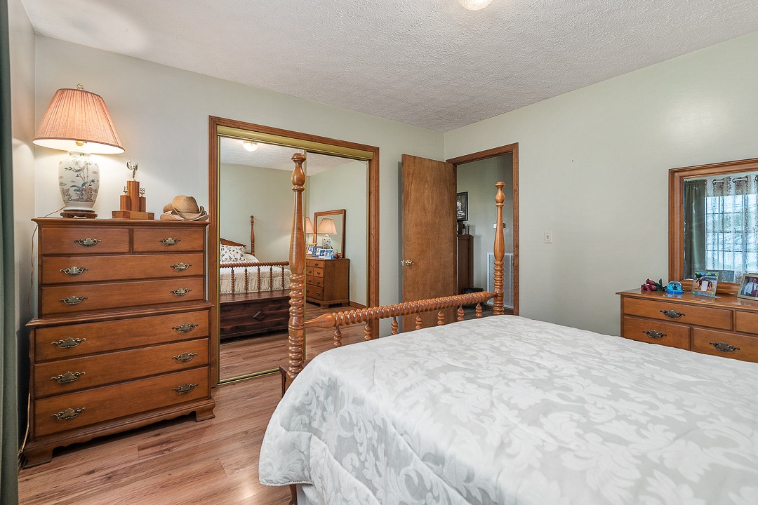 795 Owens Road Lafayette, TN 37083 - Photo 47 of 50 a bedroom with a bed and a dresser