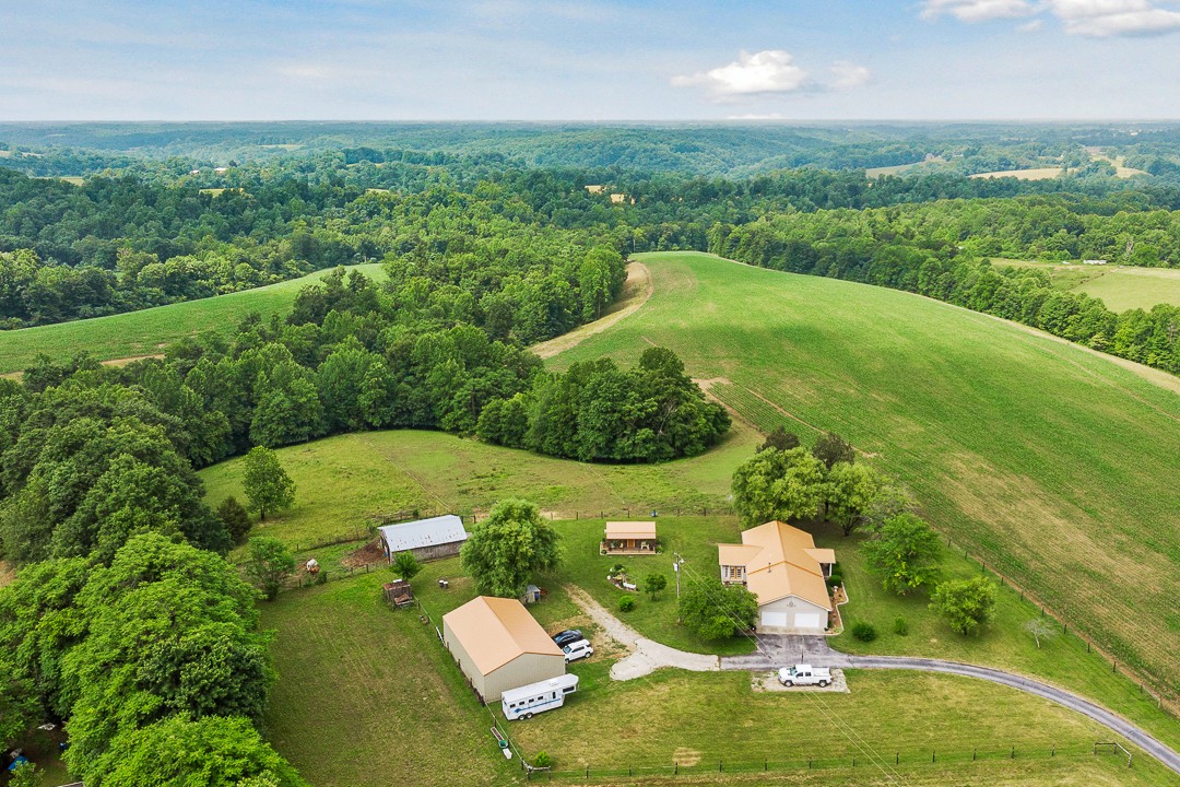 795 Owens Road Lafayette, TN 37083 - Photo 5 of 50 a view of a garden with a lake