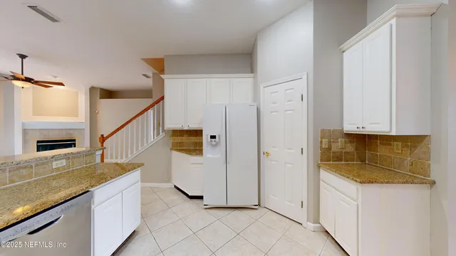 a bathroom with a sink and mirror with toilet