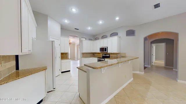 a view of a room with a fan and a fan
