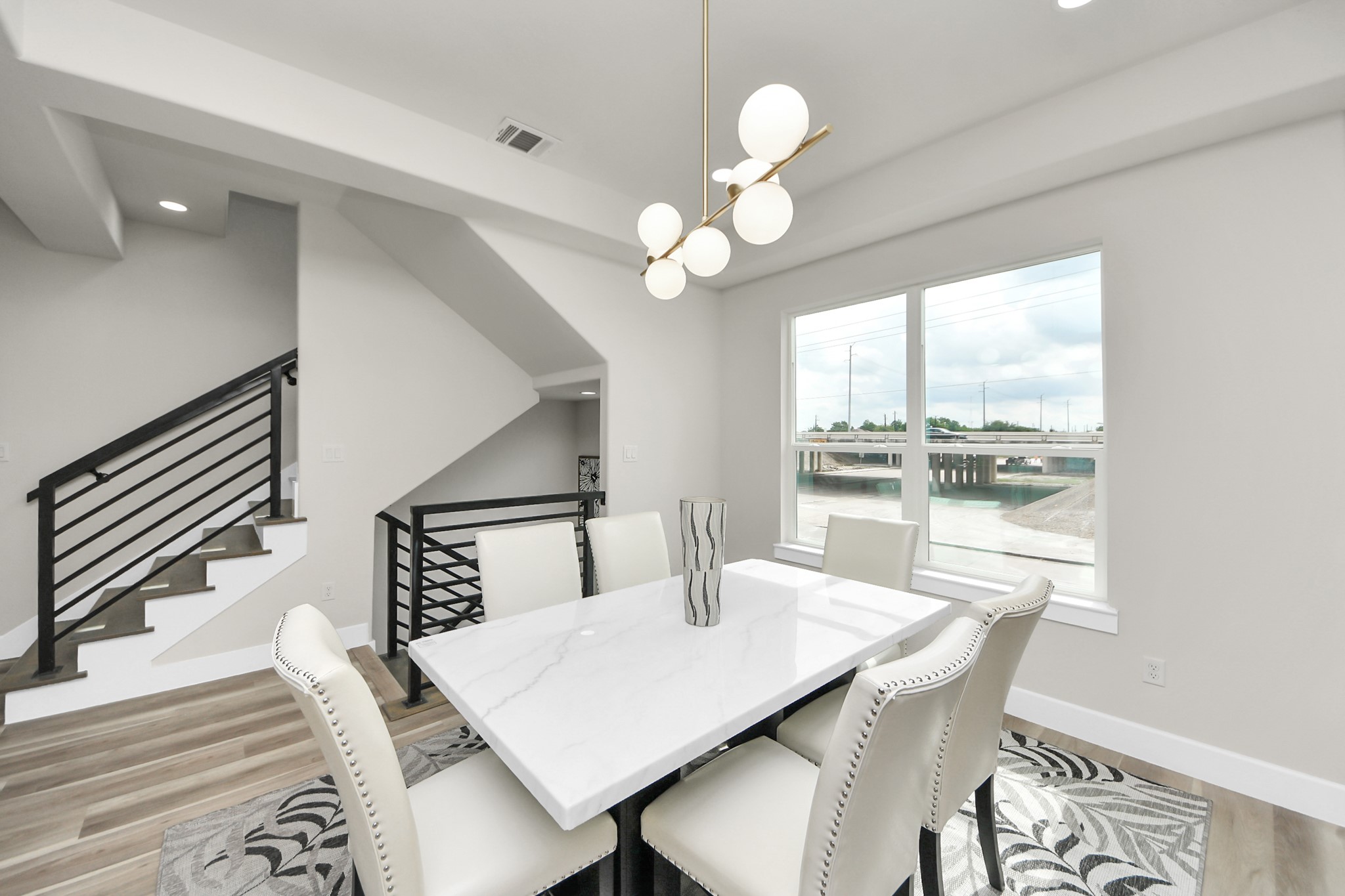2014 Blodgett Street Houston, TX 77004 - Photo 11 of 49 a view of a dining room with furniture a chandelier and wooden floor