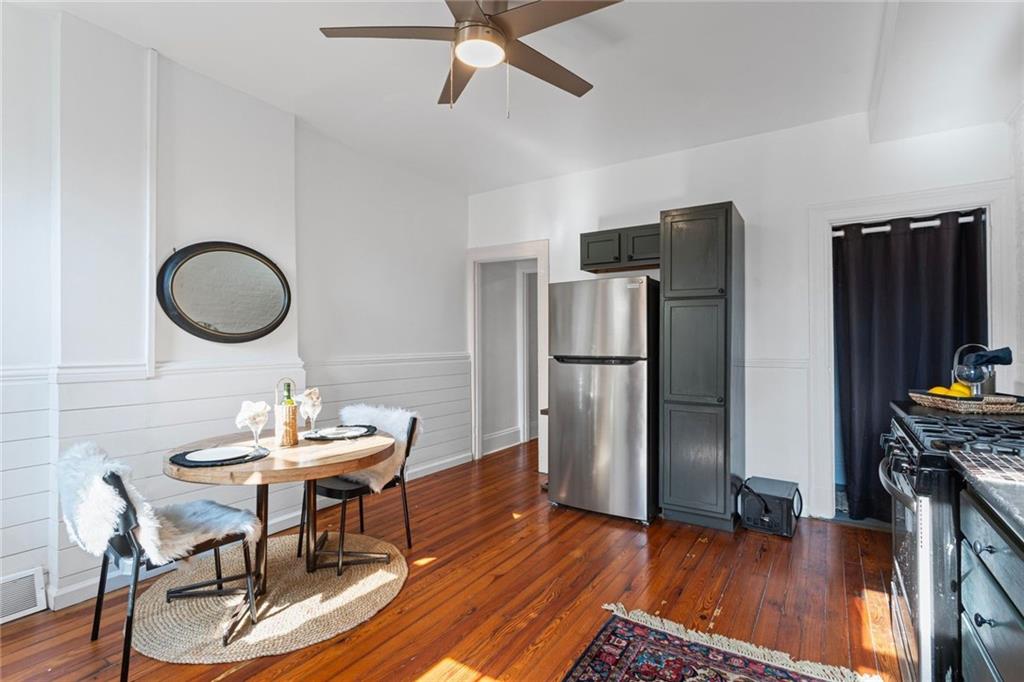 420 Fisk Street Pittsburgh, PA 15224 - Photo 14 of 30 a view of a dining room with furniture a rug and wooden floor