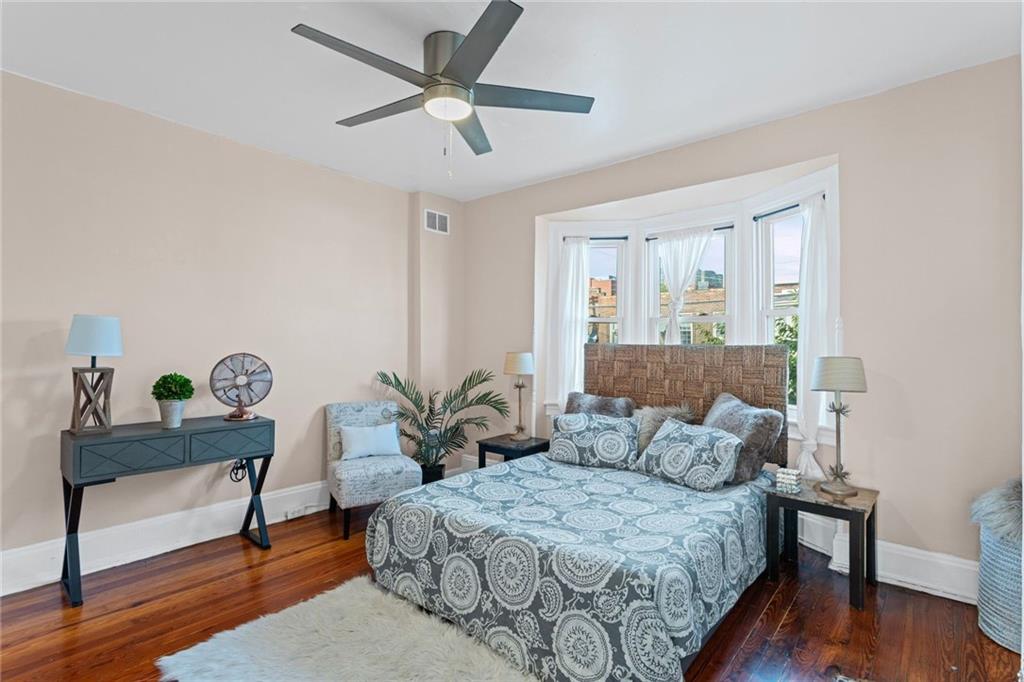 420 Fisk Street Pittsburgh, PA 15224 - Photo 15 of 30 a bedroom with a bed and a potted plant