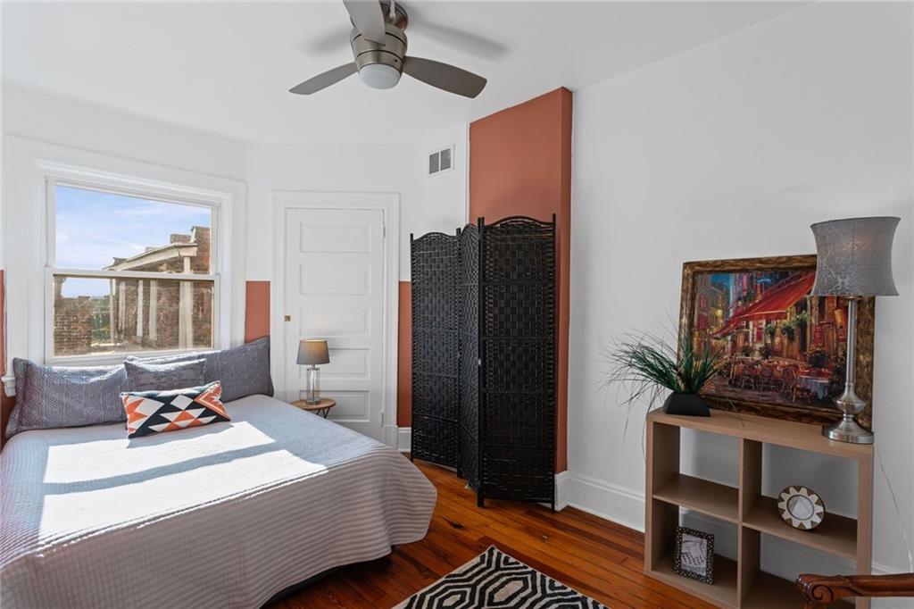 420 Fisk Street Pittsburgh, PA 15224 - Photo 18 of 30 a bedroom with a bed dresser and a window