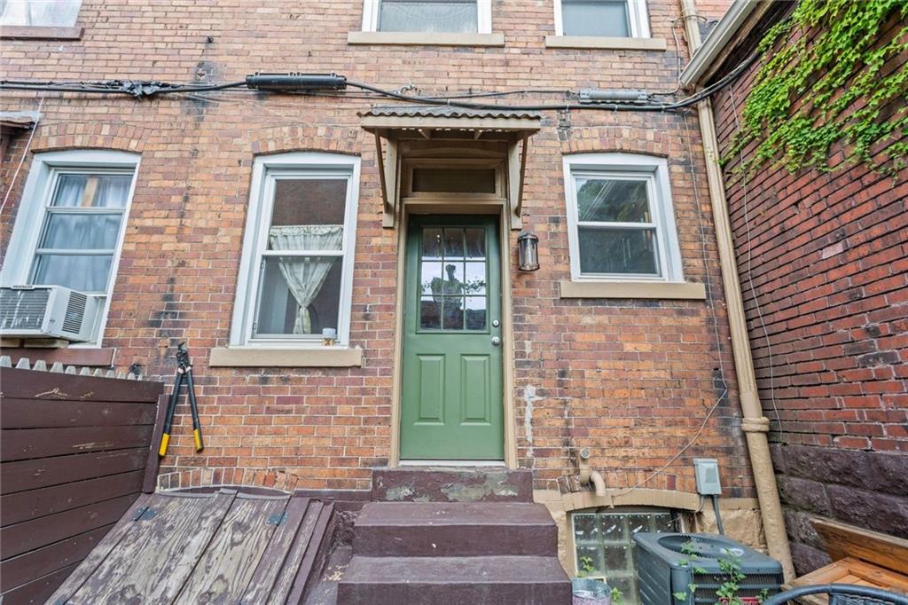 420 Fisk Street Pittsburgh, PA 15224 - Photo 29 of 30 a front view of a house with a garden