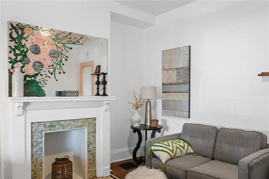 420 Fisk Street Pittsburgh, PA 15224 - Photo 8 of 30 a living room with furniture and a fireplace