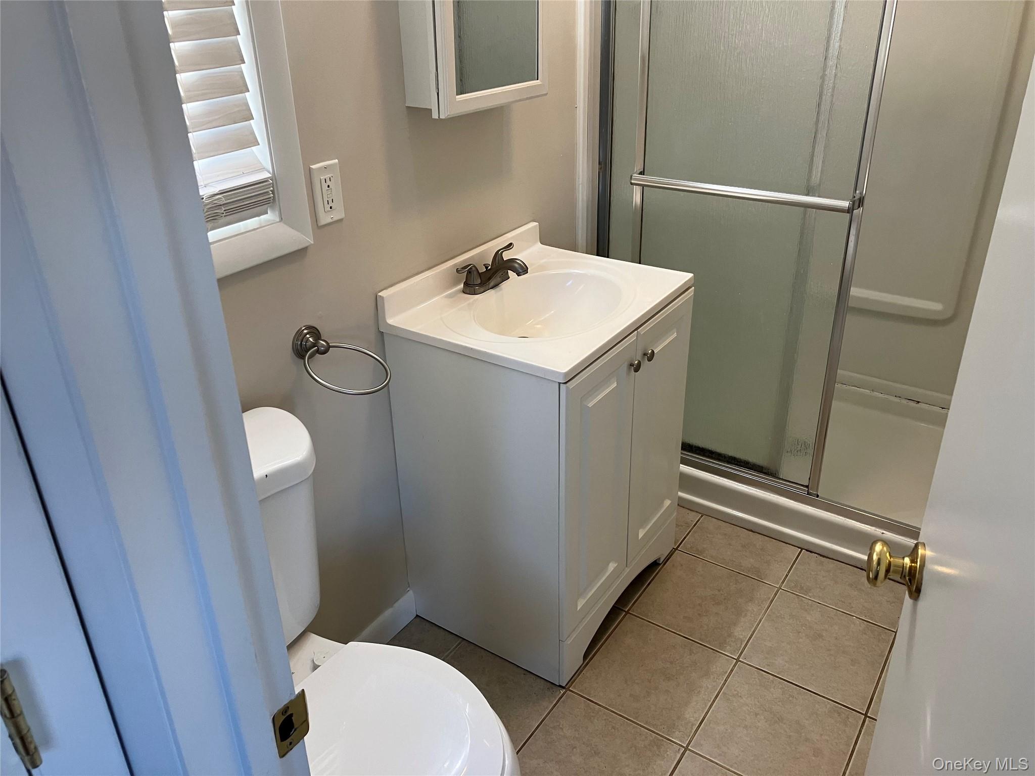10 South Walnut Street Beacon, NY 12508 - Photo 17 of 18 a bathroom with a sink toilet and shower