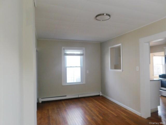 10 South Walnut Street Beacon, NY 12508 - Photo 4 of 18 an empty room with wooden floor and windows