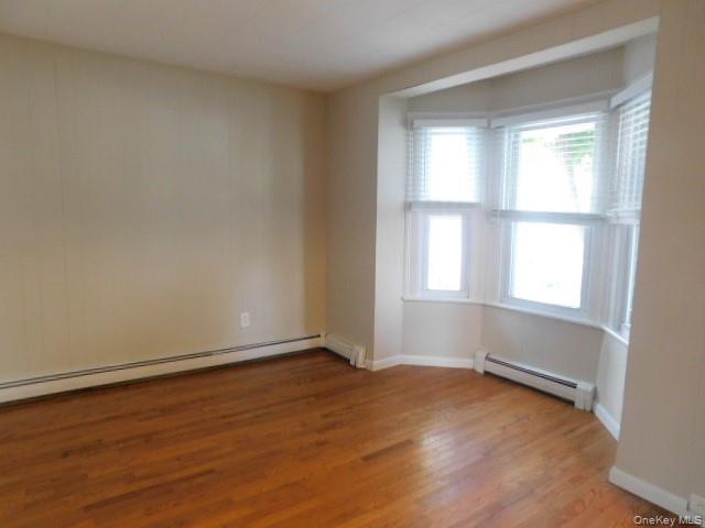 10 South Walnut Street Beacon, NY 12508 - Photo 8 of 18 an empty room with wooden floor and windows