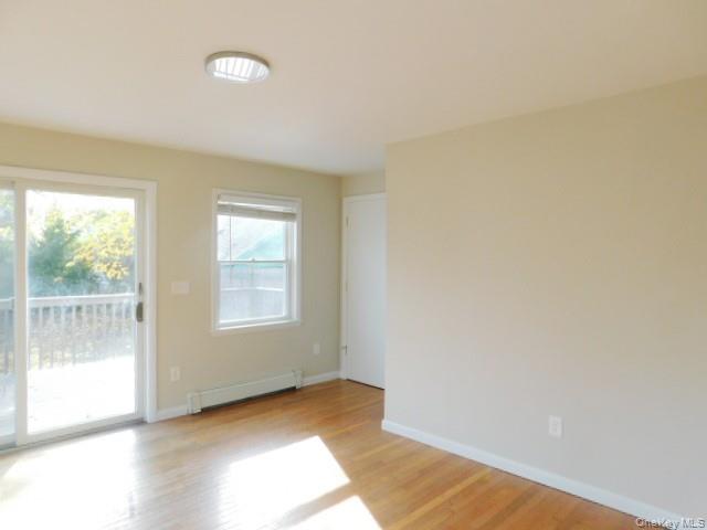 10 South Walnut Street Beacon, NY 12508 - Photo 9 of 18 an empty room with wooden floor and windows