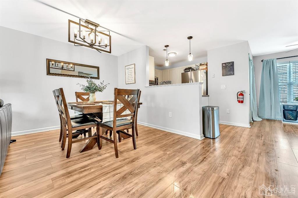 2510 Ridgeview Court Sayreville, NJ 08859 - Photo 12 of 28 a view of a dining room with furniture and wooden floor