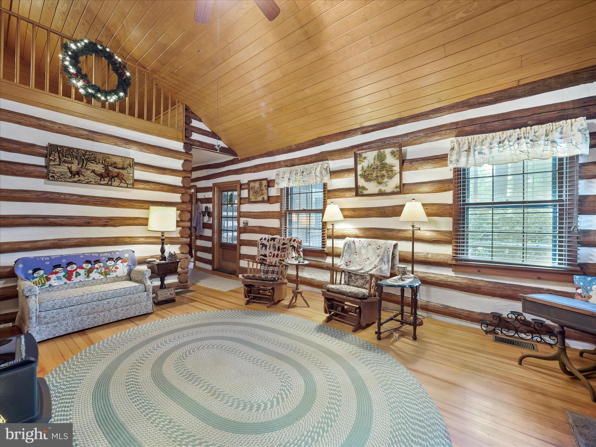 10086 Golf Course Road Fayetteville, PA 17222 - Photo 12 of 33 a living room with furniture and a large window