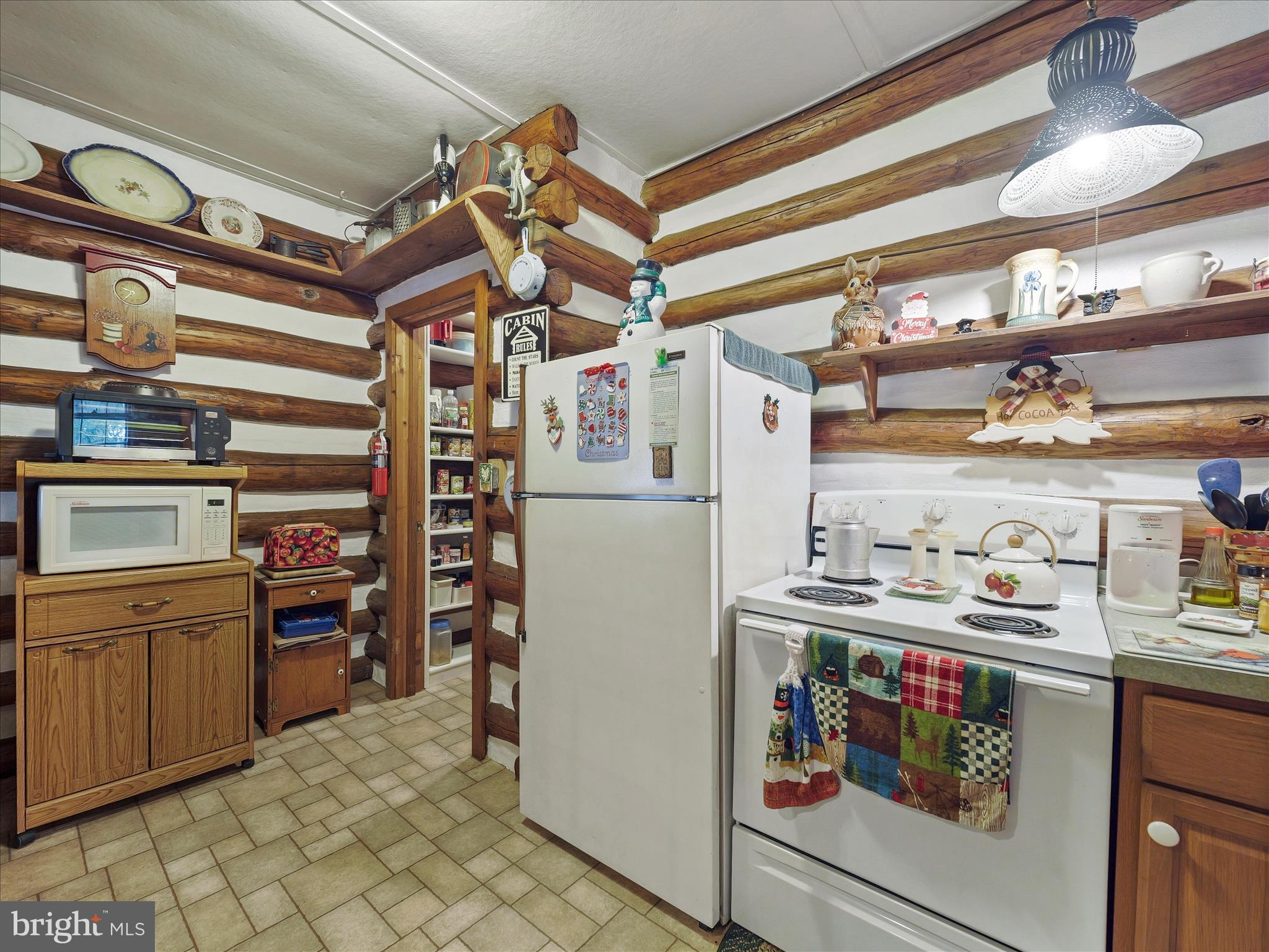 10086 Golf Course Road Fayetteville, PA 17222 - Photo 17 of 33 a kitchen with stainless steel appliances and cabinets