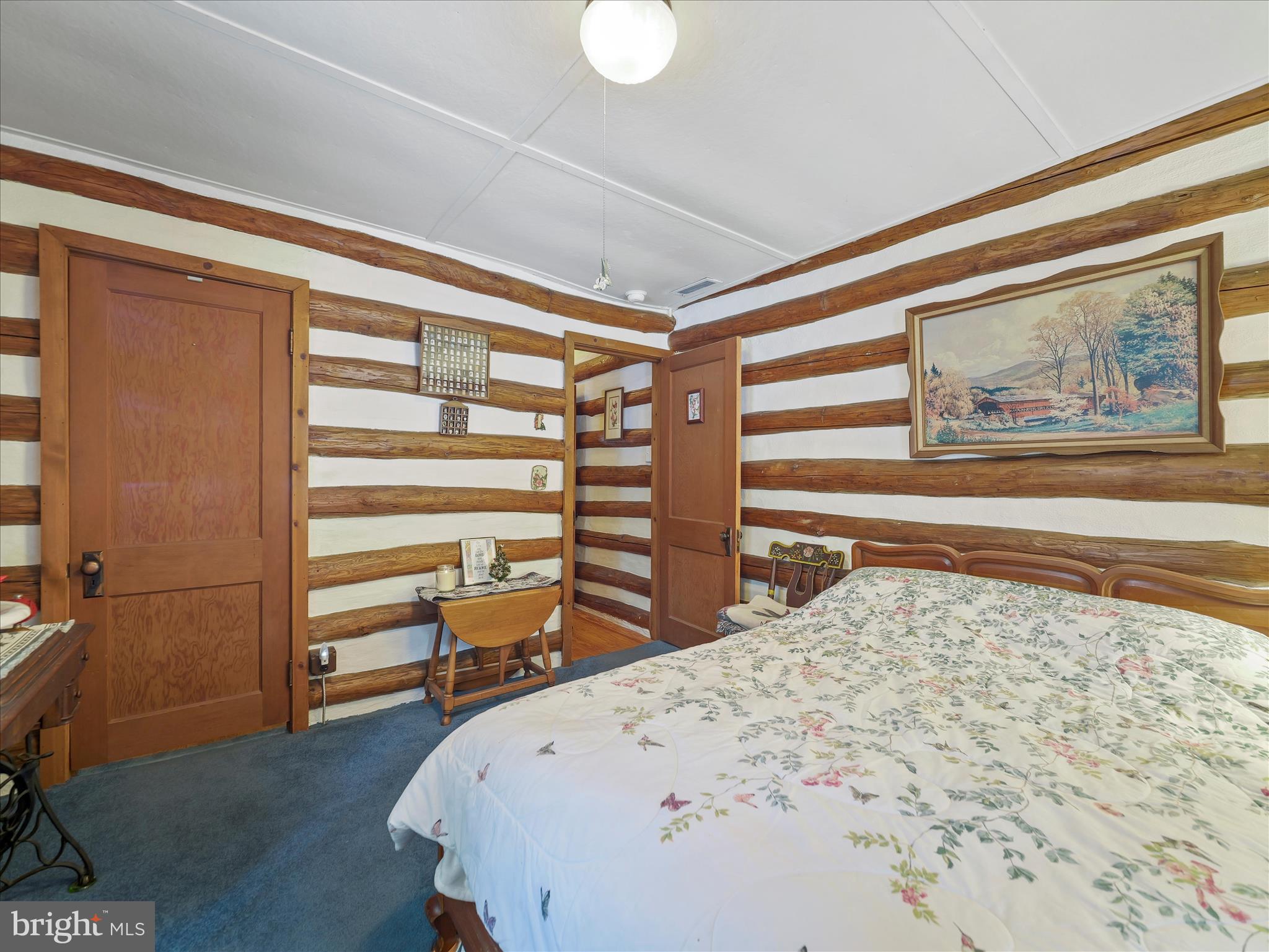 10086 Golf Course Road Fayetteville, PA 17222 - Photo 23 of 33 a bedroom with a bed and a painting on the wall