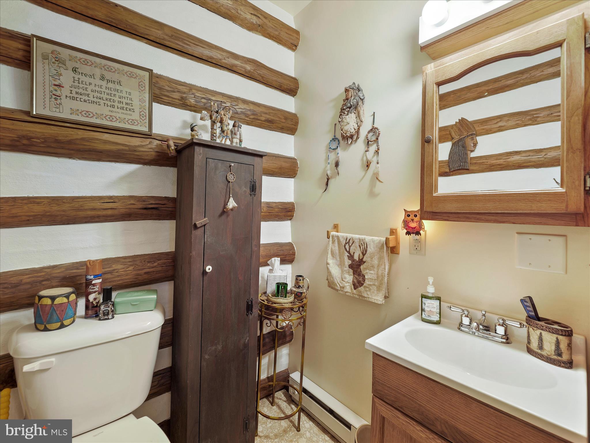 10086 Golf Course Road Fayetteville, PA 17222 - Photo 25 of 33 a bathroom with a sink a toilet and shower