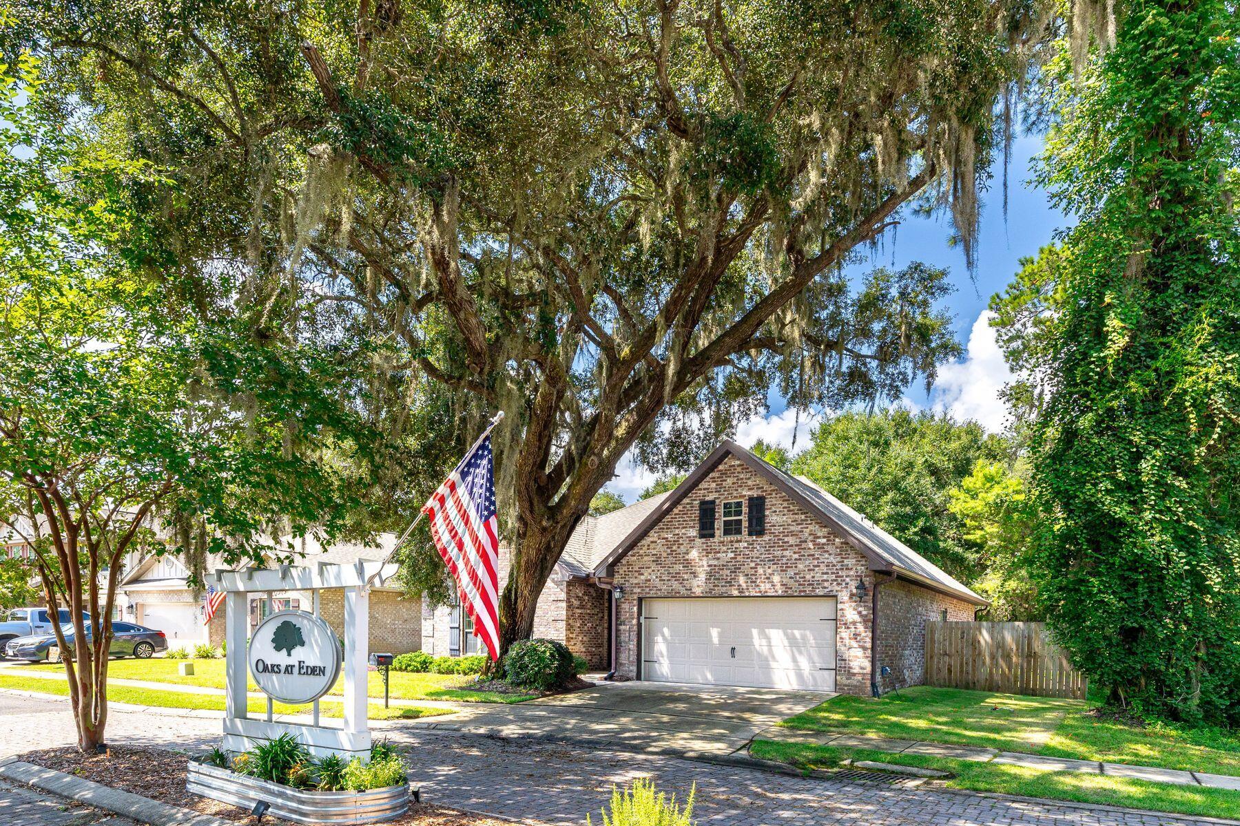 20 Big Oak Lane Santa Rosa Beach, FL 32459 - Photo 24 of 31 a front view of a house with garden