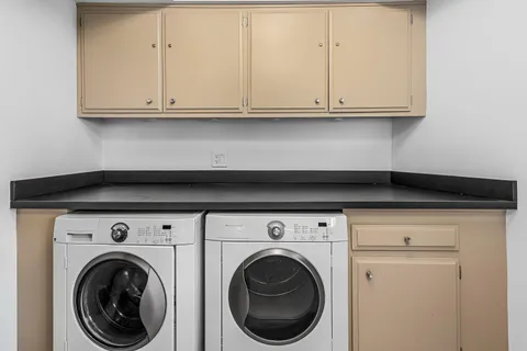 a close view of a stove with white cabinet