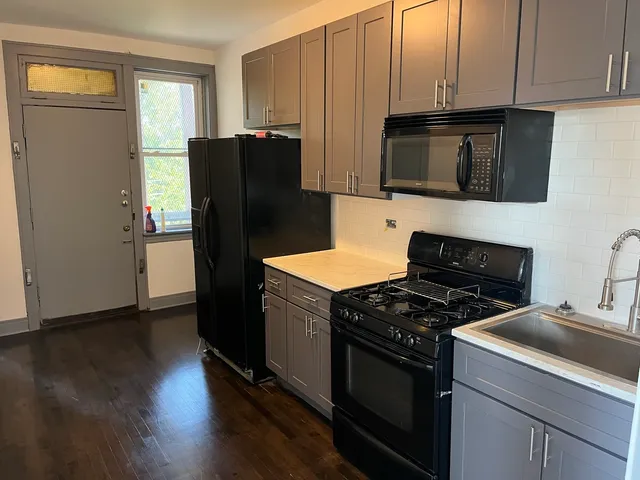 a kitchen with a stove microwave and refrigerator