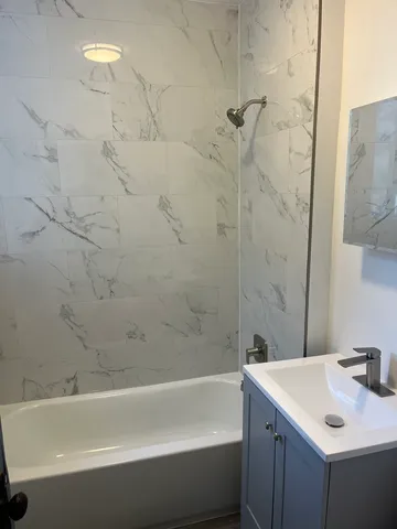 a bathroom with a sink and a bathtub