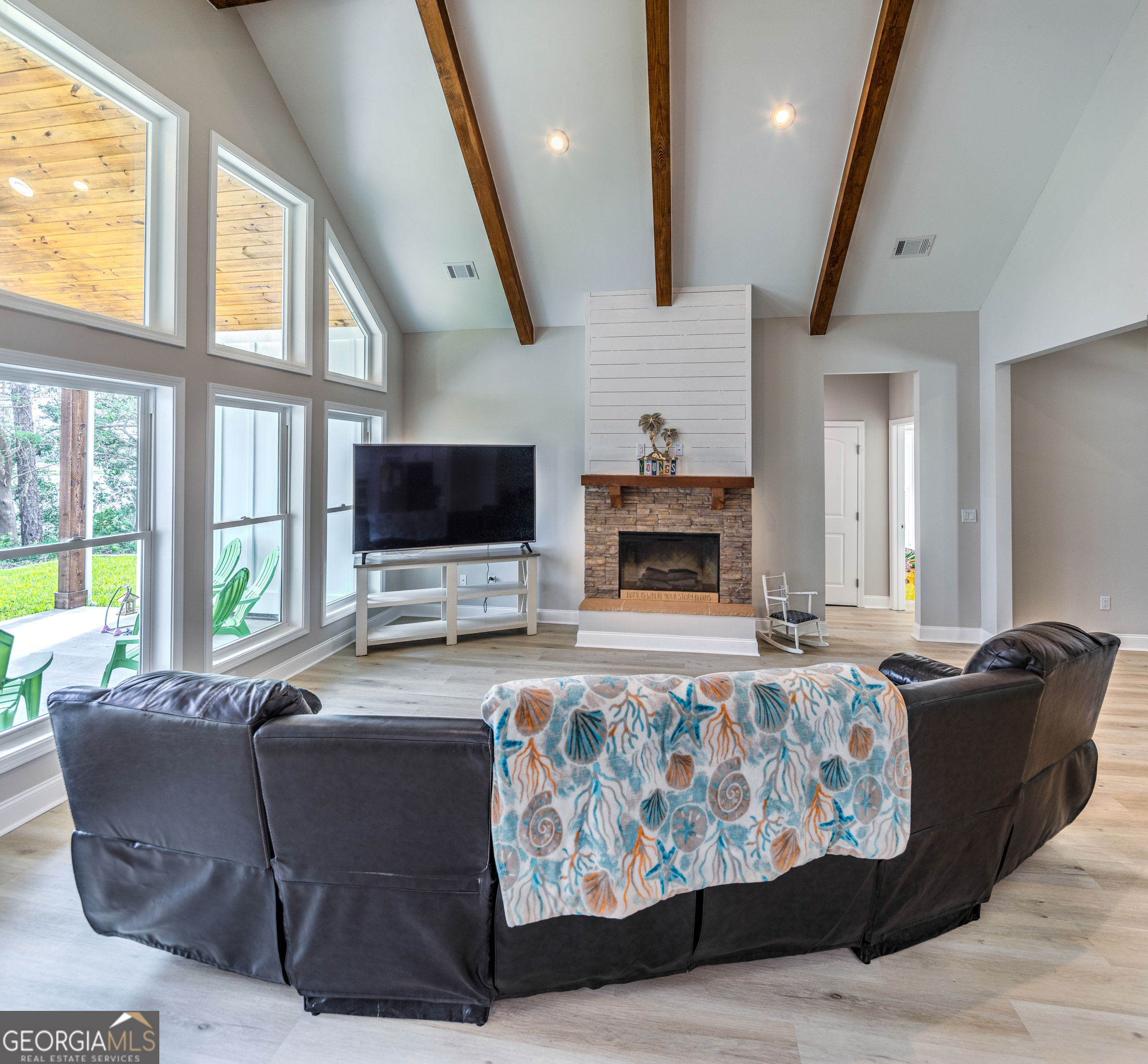 87 Lighthouse Way Woodbine, GA 31569 - Photo 16 of 116 a living room with furniture fireplace and flat screen tv