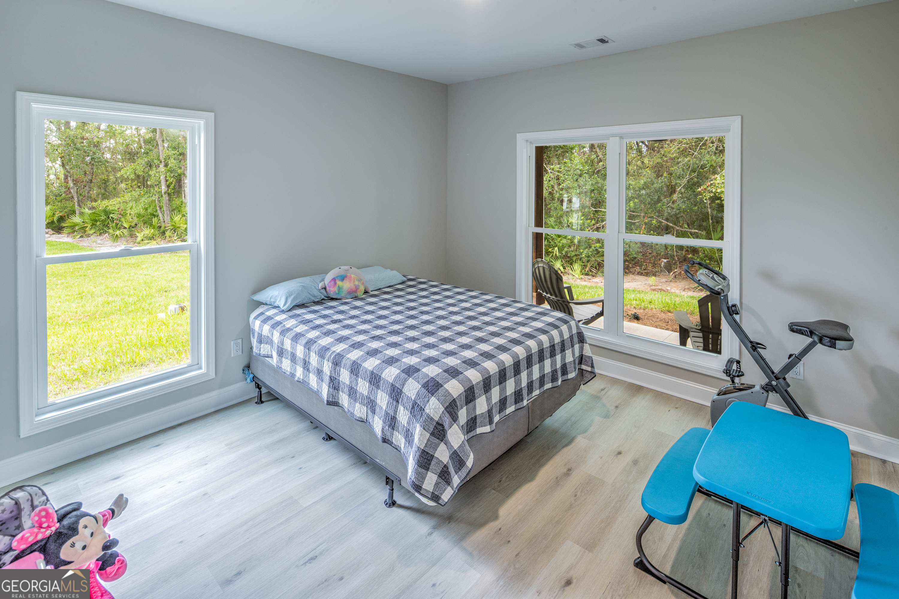 87 Lighthouse Way Woodbine, GA 31569 - Photo 20 of 116 a bedroom with a bed chair and window