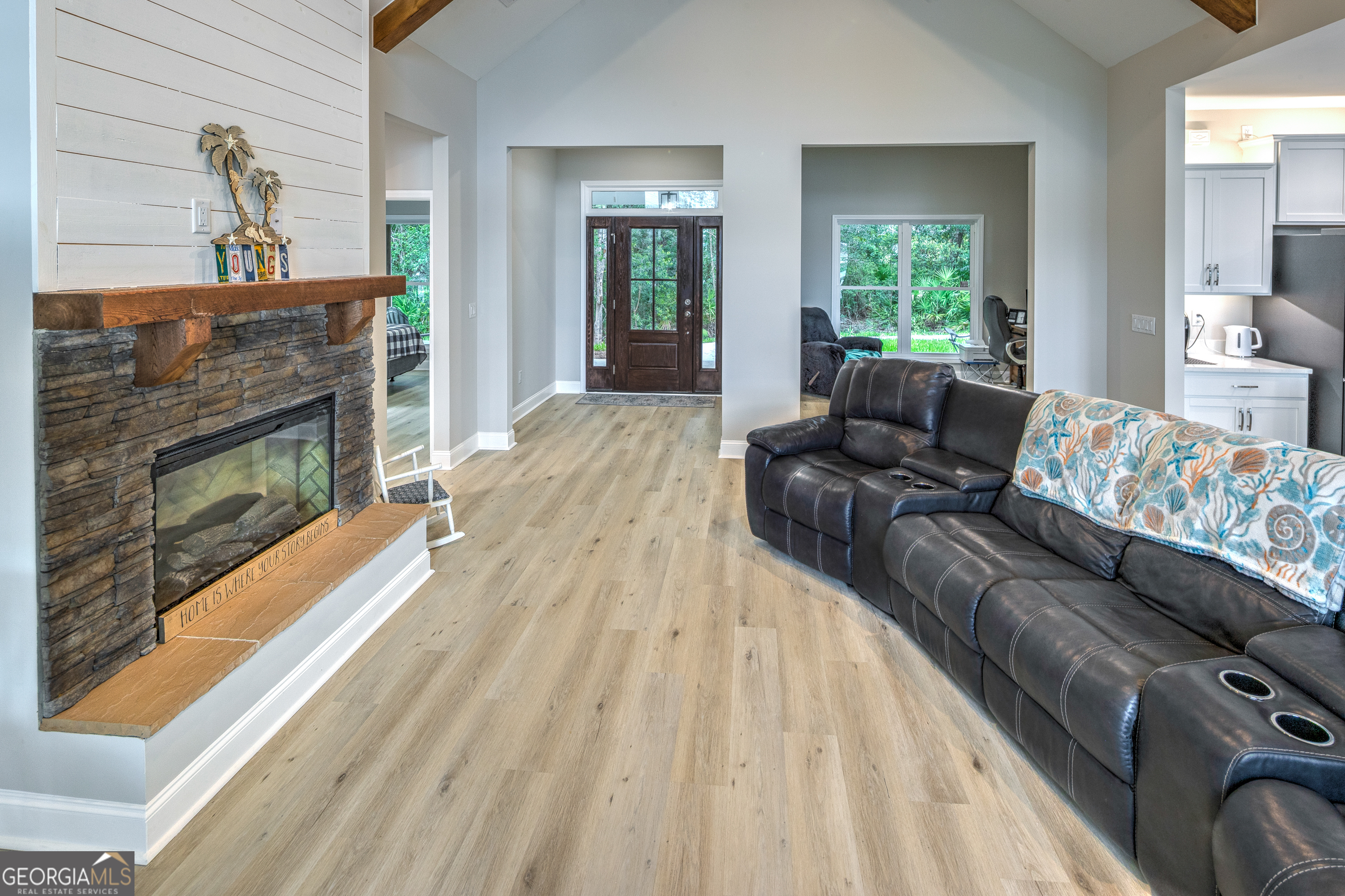 87 Lighthouse Way Woodbine, GA 31569 - Photo 46 of 116 a living room with furniture and a fireplace