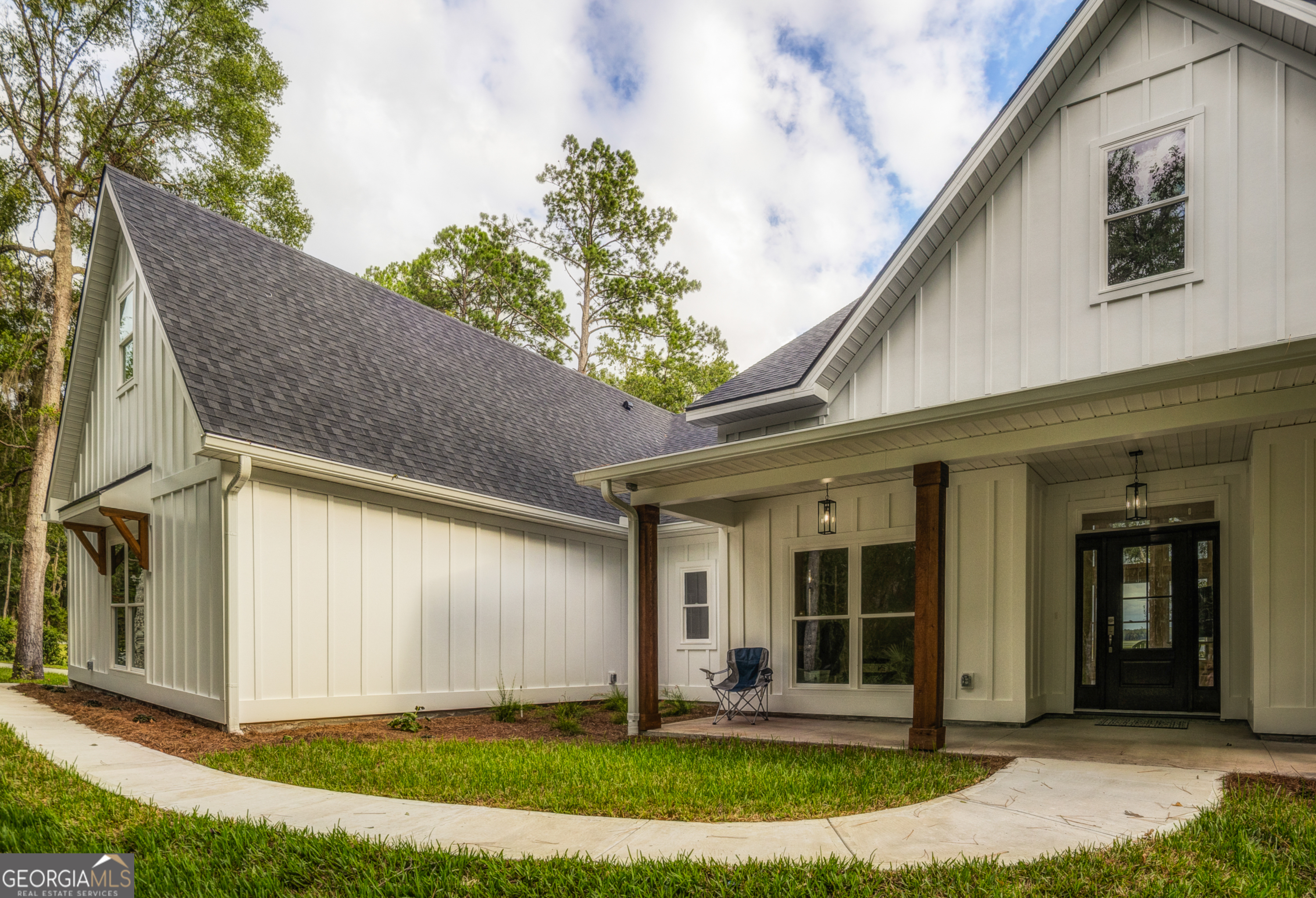 87 Lighthouse Way Woodbine, GA 31569 - Photo 55 of 116 a front view of a house with a yard