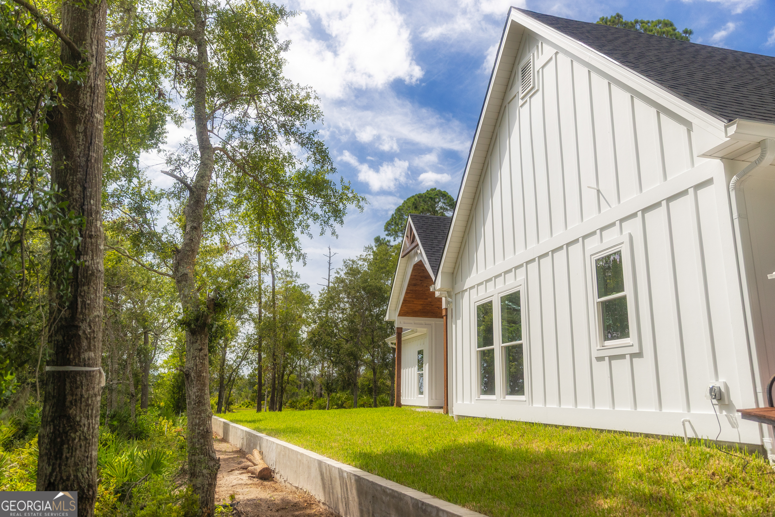 87 Lighthouse Way Woodbine, GA 31569 - Photo 62 of 116 a view of swimming pool with a house in the background