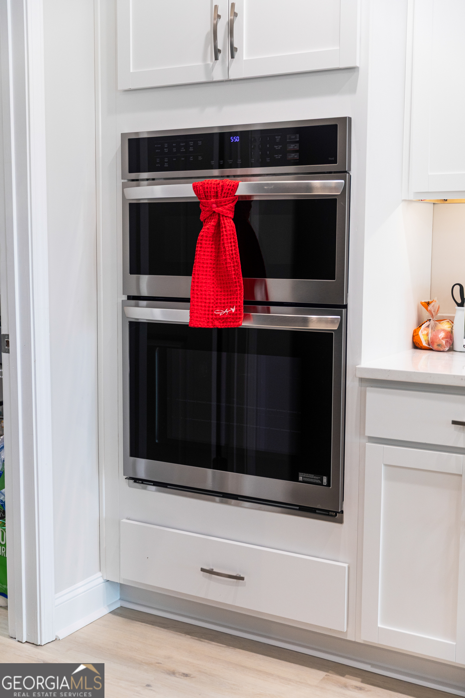 87 Lighthouse Way Woodbine, GA 31569 - Photo 70 of 116 a stove top oven sitting inside of a kitchen and cabinet