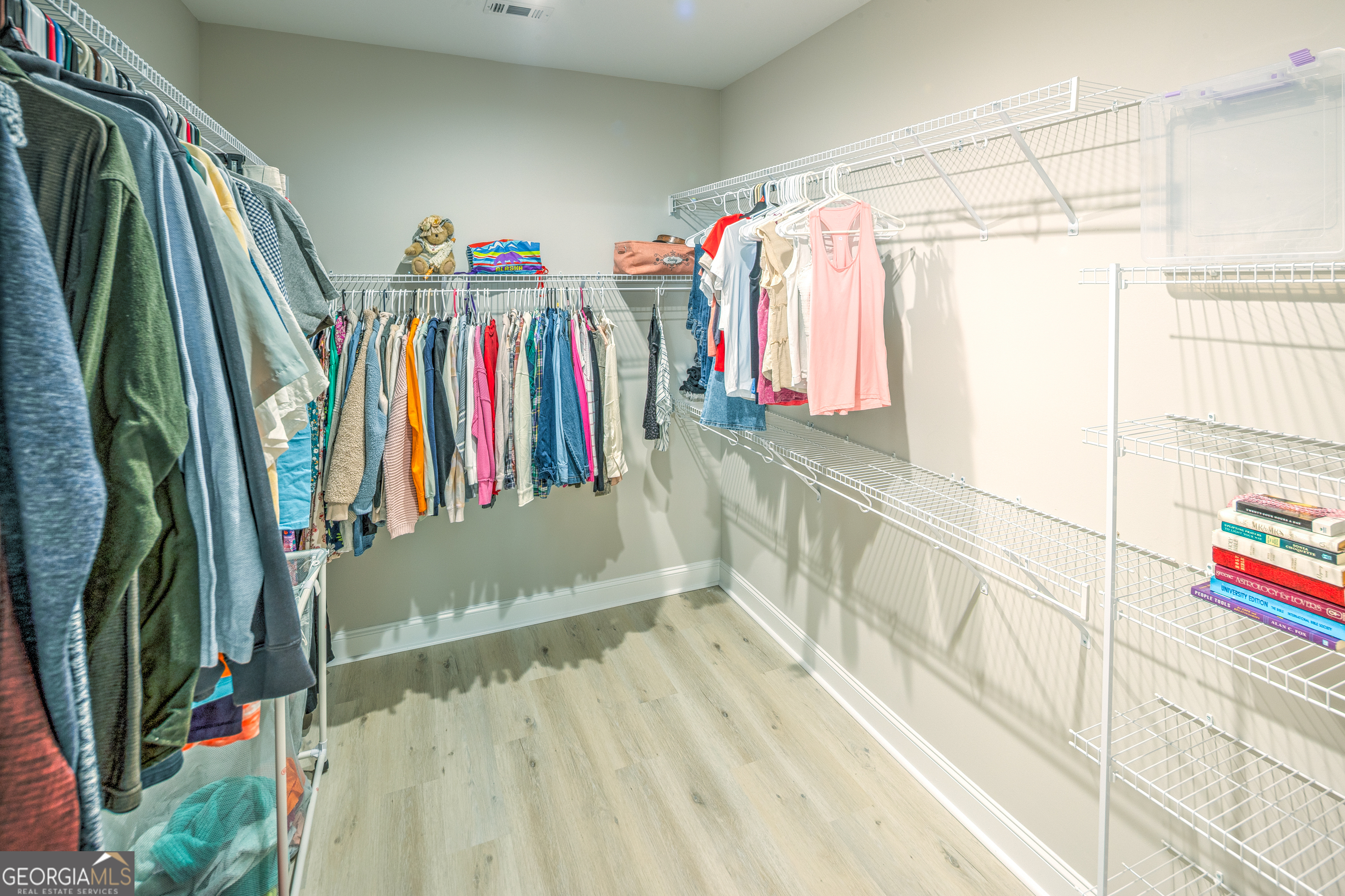 87 Lighthouse Way Woodbine, GA 31569 - Photo 75 of 116 a view of walk in closet with clothes