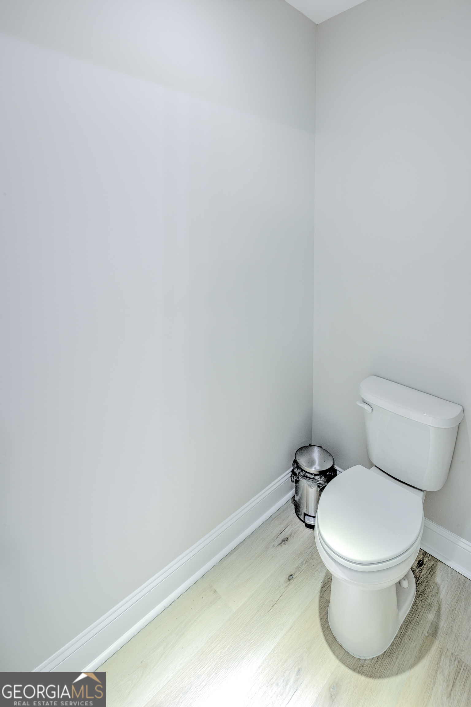 87 Lighthouse Way Woodbine, GA 31569 - Photo 77 of 116 a white toilet sitting next to a white wall