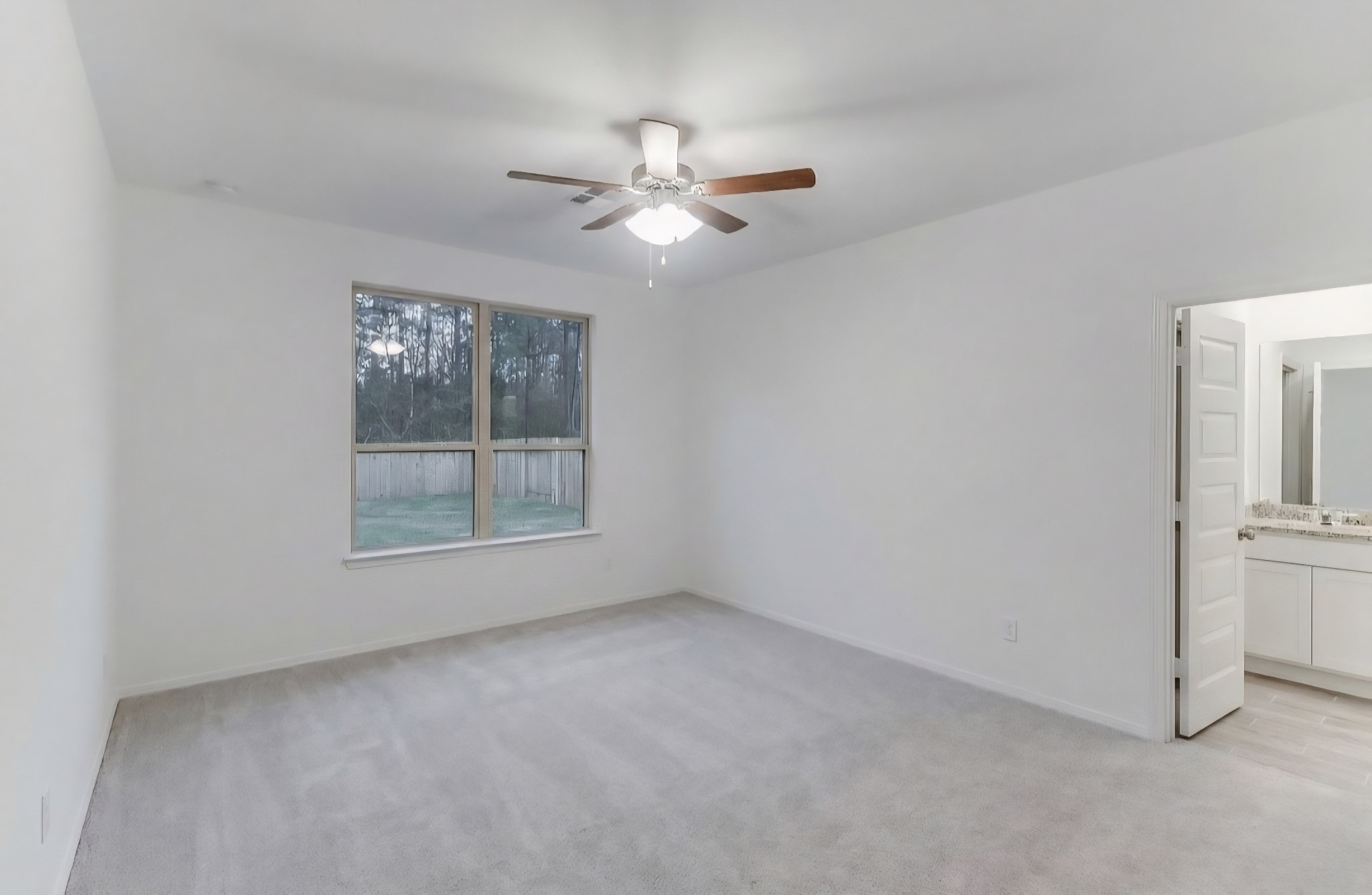 14423 Sunny Bend Way Conroe, TX 77303 - Photo 5 of 9 a view of empty room with window