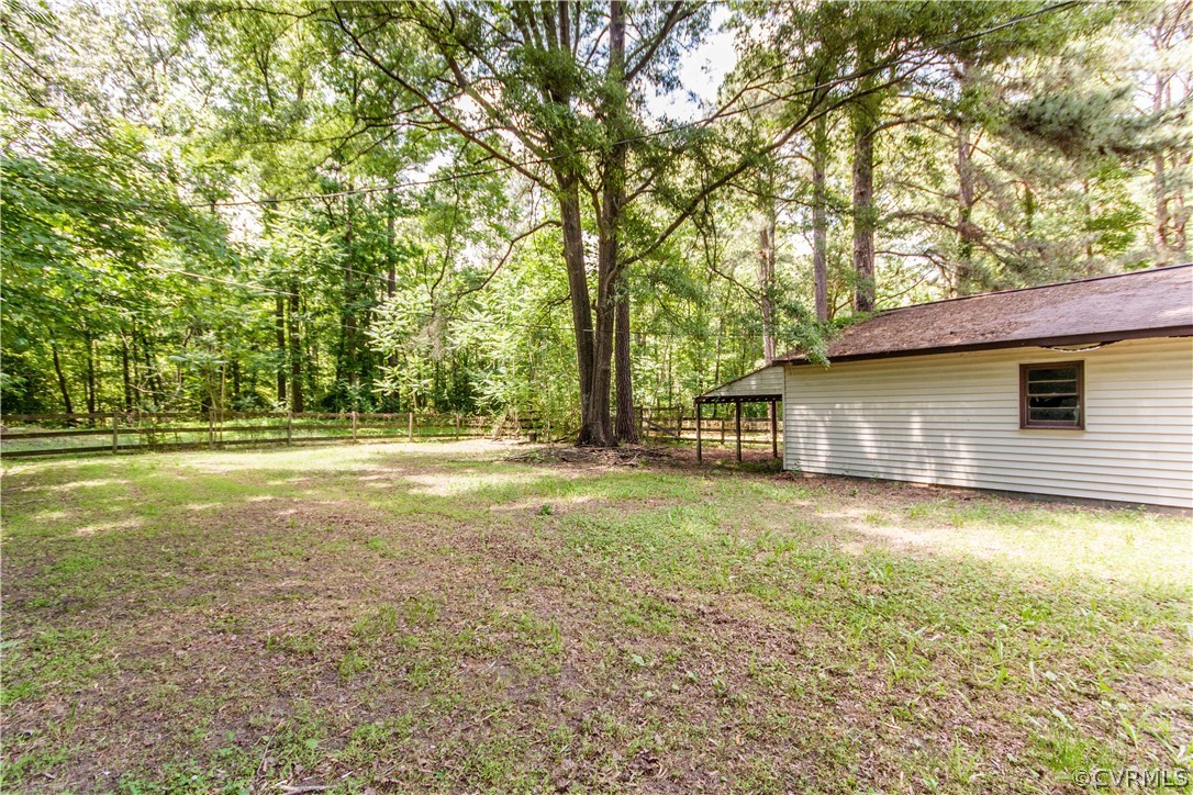 14912 Nash Road Chesterfield, VA 23838 - Photo 11 of 31 a backyard of a house with lots of green space