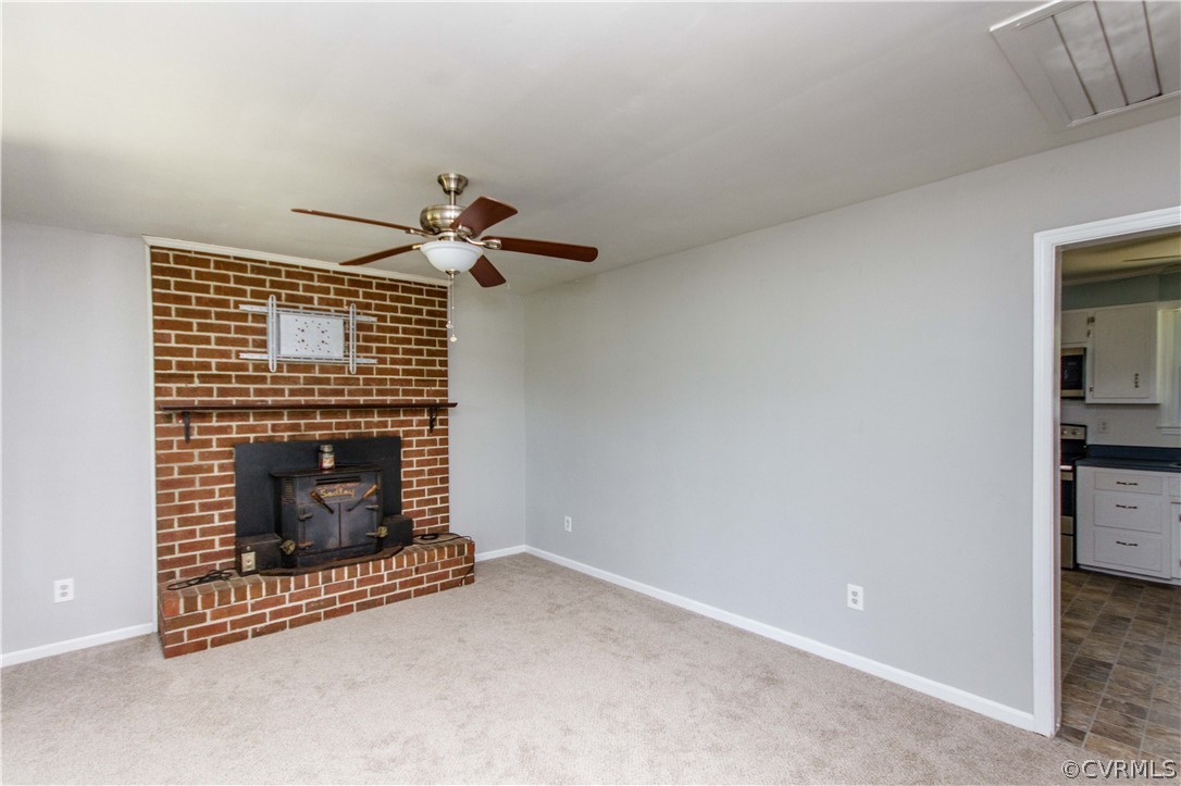 14912 Nash Road Chesterfield, VA 23838 - Photo 12 of 31 a living room with furniture and a fireplace