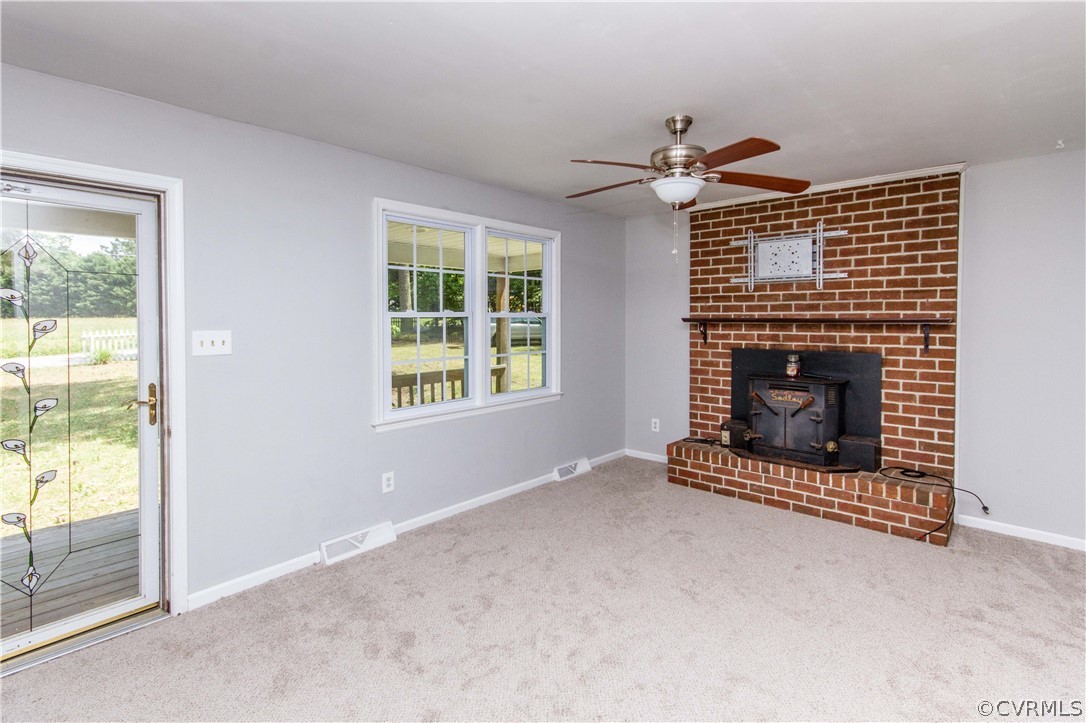 14912 Nash Road Chesterfield, VA 23838 - Photo 13 of 31 an empty room with windows and fireplace