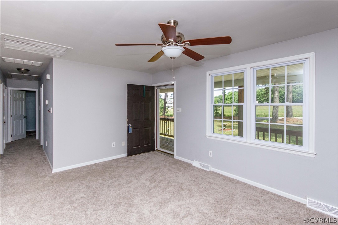 14912 Nash Road Chesterfield, VA 23838 - Photo 14 of 31 an empty room with chandelier fan and windows