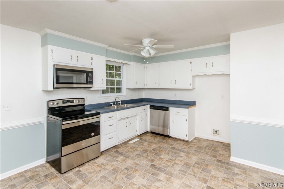 14912 Nash Road Chesterfield, VA 23838 - Photo 17 of 31 a kitchen with a stove oven and a microwave