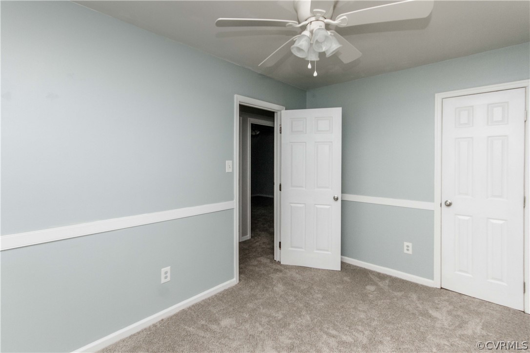 14912 Nash Road Chesterfield, VA 23838 - Photo 21 of 31 an empty room with closet and a ceiling fan