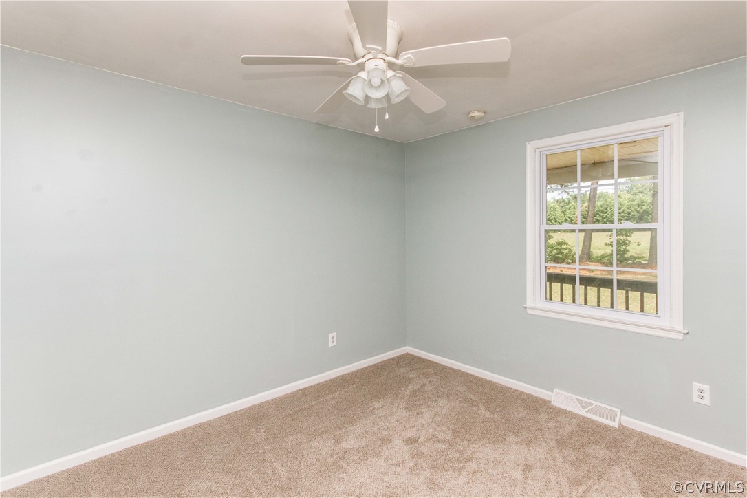 14912 Nash Road Chesterfield, VA 23838 - Photo 28 of 31 an empty room with a window and a fan