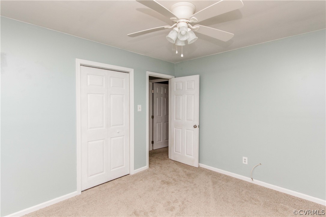 14912 Nash Road Chesterfield, VA 23838 - Photo 30 of 31 an empty room with a ceiling fan and a bathroom