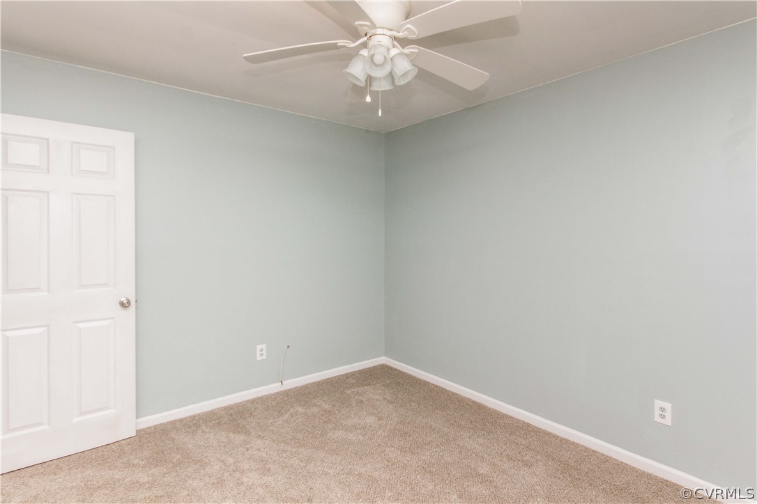 14912 Nash Road Chesterfield, VA 23838 - Photo 31 of 31 an empty room with a chandelier fan and closet