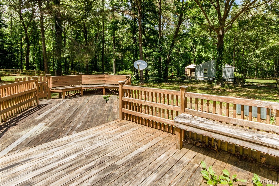 14912 Nash Road Chesterfield, VA 23838 - Photo 7 of 31 a view of a balcony with wooden floor and fence