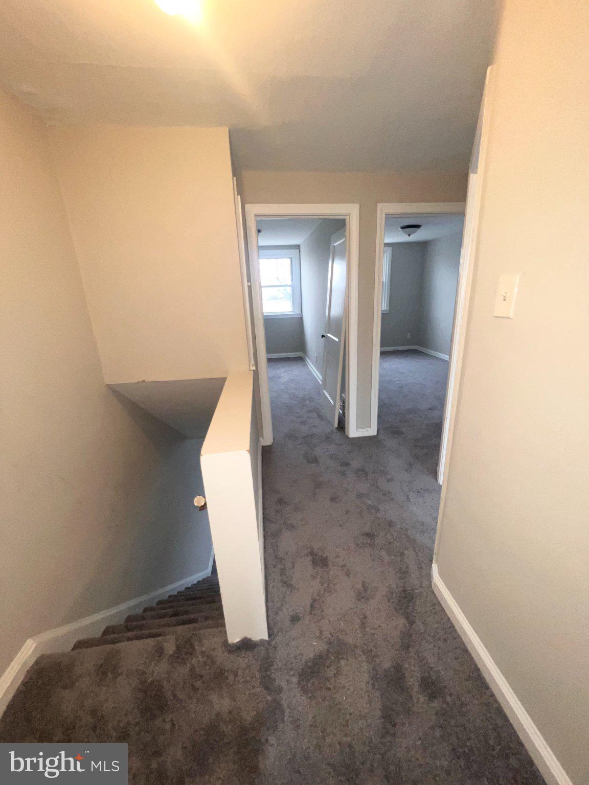 920 Butler Street Chester, PA 19013 - Photo 8 of 10 Inviting hallway with soft carpet.