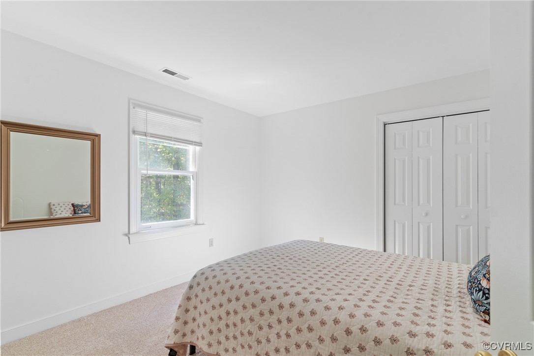 14310 Long Gate Road Midlothian, VA 23112 - Photo 15 of 31 a bedroom with a bed and a window