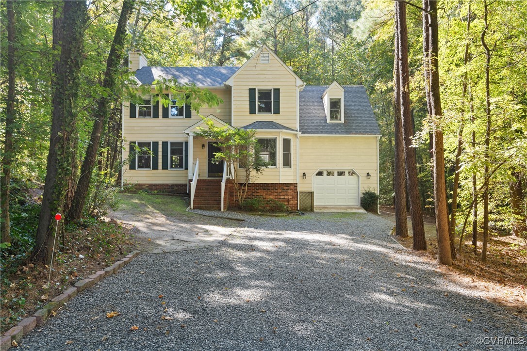 14310 Long Gate Road Midlothian, VA 23112 - Photo 2 of 31 a front view of a house with a yard and garage