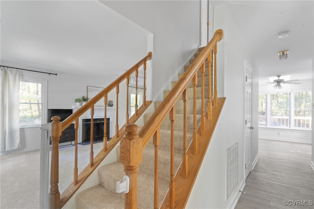 14310 Long Gate Road Midlothian, VA 23112 - Photo 3 of 31 a view of staircase with lots of windows and wooden floor